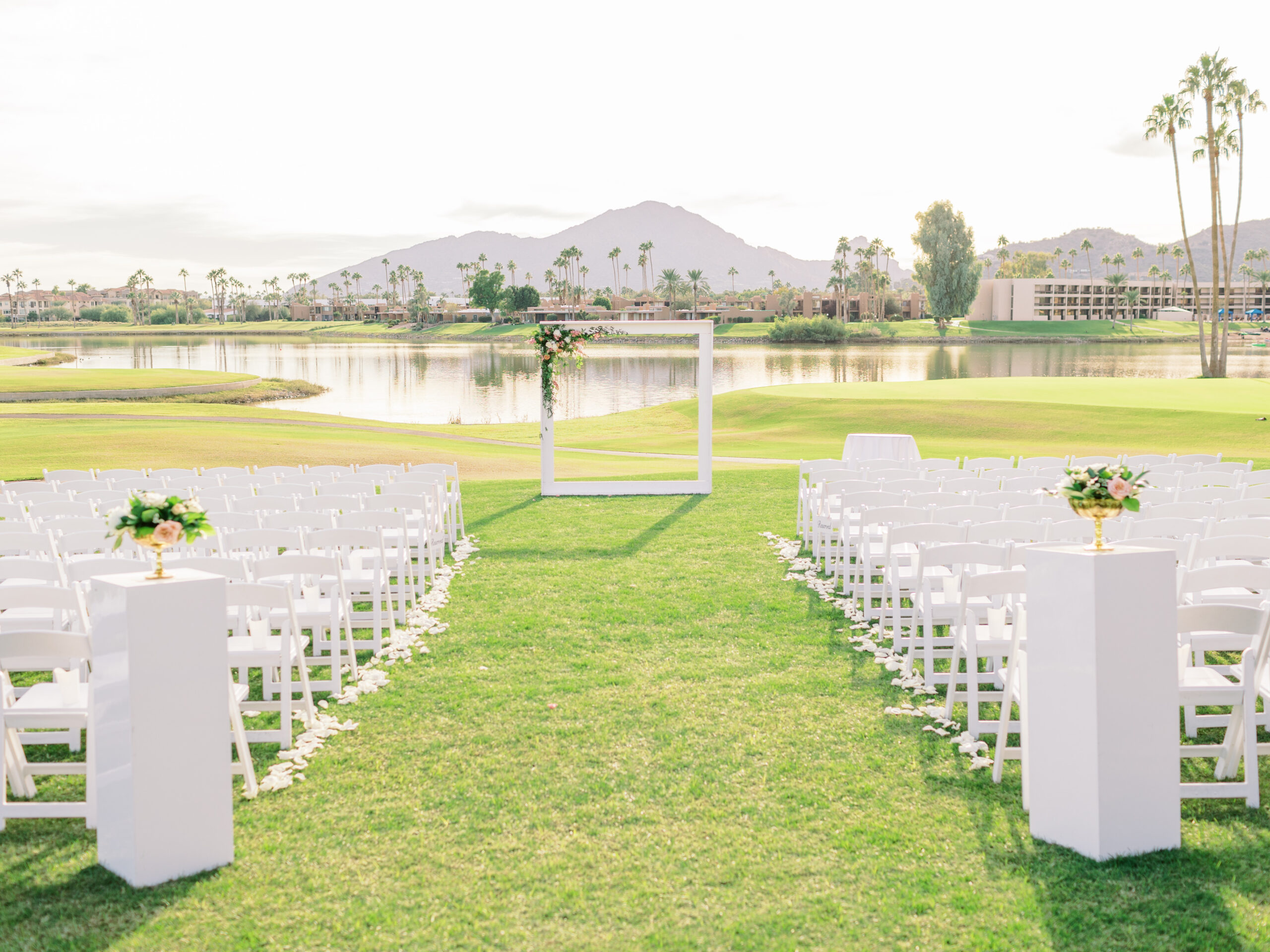 mccormick-ranch-golf-club-event-lawn-ceremony-white-frame-arch-and-chairs