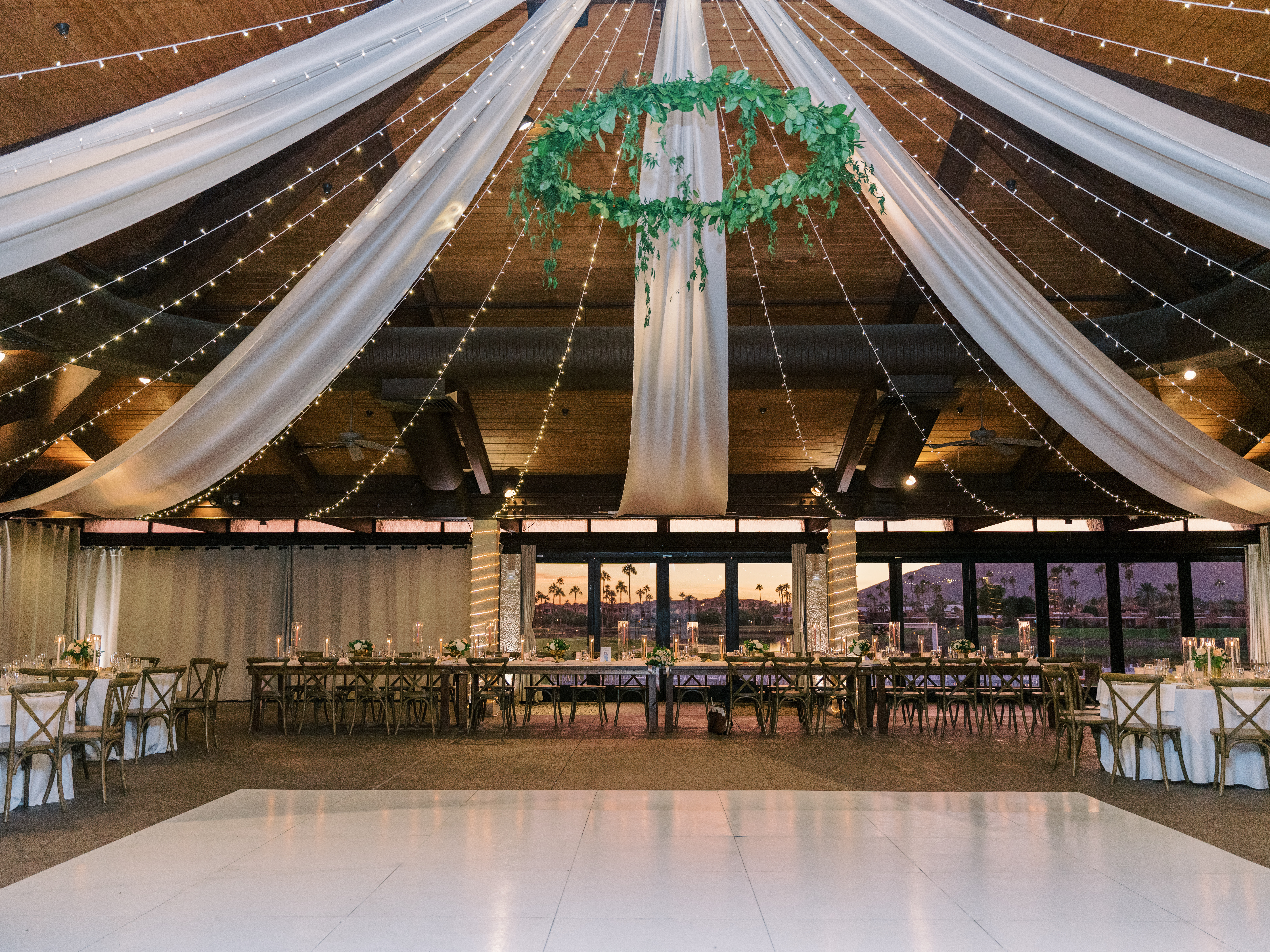 mccormick-ranch-golf-club-pavillion-wedding-reception-white-dance-floor-and-draping-greenery-chandelier